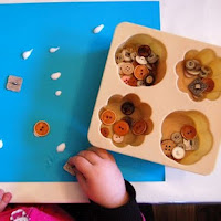 Use buttons for fine motor activities