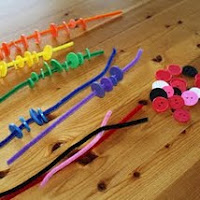 Thread buttons onto pipe cleaners for fine motor skills