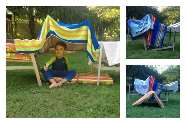 A kids fort made with towels and chairs!