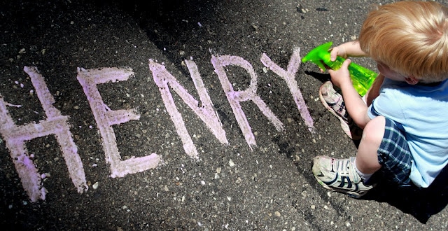 Challenge your child to spray their name - written in chalk - off the driveway or sidewalk!