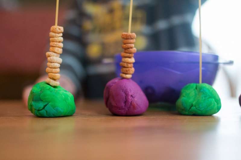 Play dough balls for a cereal threading activity for toddlers