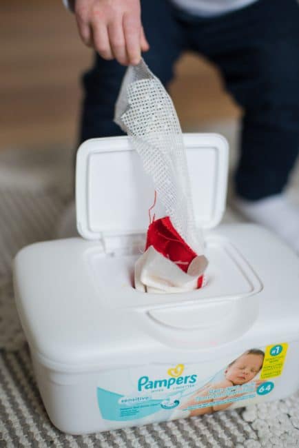Hours of fun for babies and toddlers with a wipe container and fabric. Simple baby sensory activity