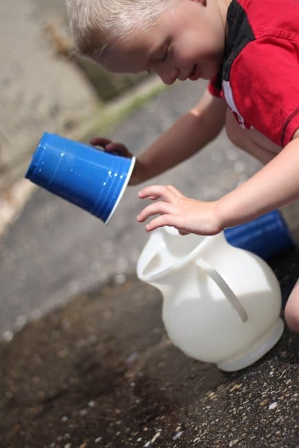 Work on an important life skill, pouring, with a fun fine motor activity for toddlers!