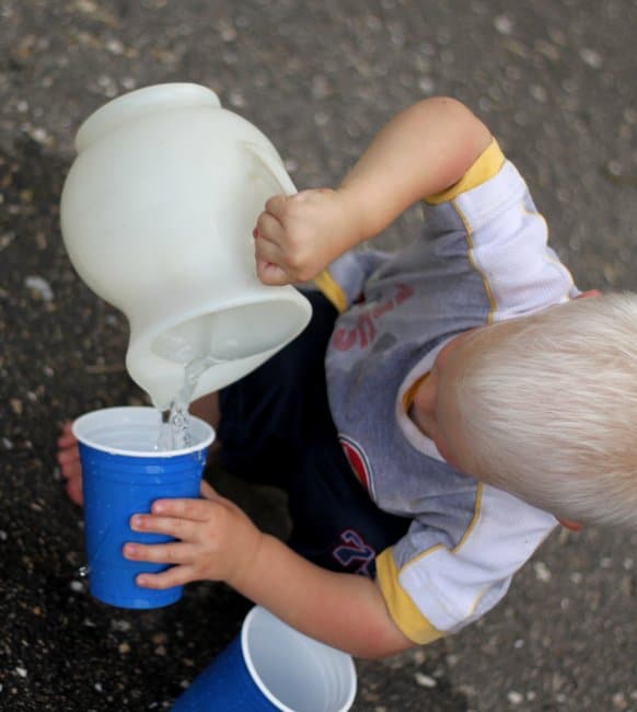 Work on an important life skill, pouring water, with a fun fine motor activity for toddlers!