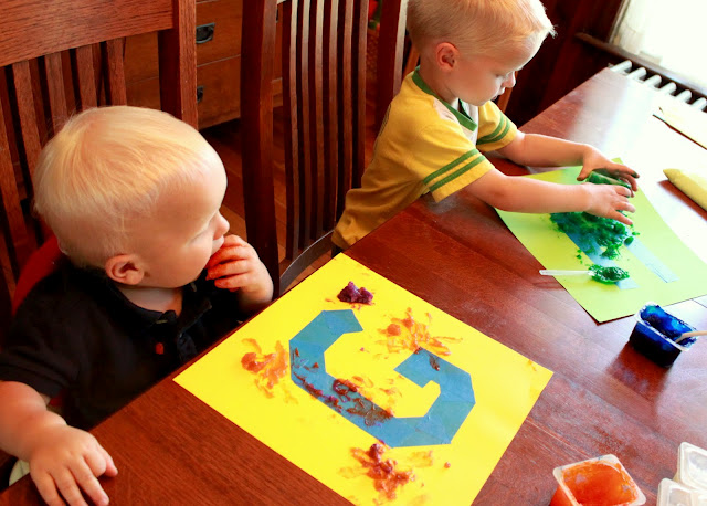 Tape resist painting using homemade edible finger paints
