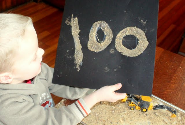 Take sand sensory play to a new level and create a number 100 art project or any other picture you want with your toddler or preschoolers!