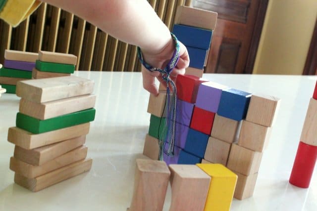 Stacking blocks while sorting them by shape