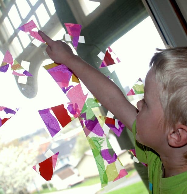 Make a pretty tissue paper cross collage for a kid-friendly Easter craft and window decoration!