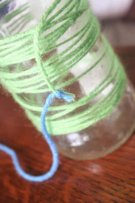 tying off the yarn to add another color to the vase
