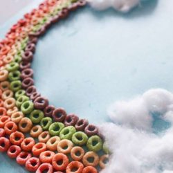 Make a colorful Cheerio rainbow craft with the kids