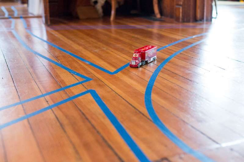 The simplest toddler and preschooler activity! Create a tape road with just two supplies! Get the kids moving with this easy gross motor activity you can do at home!
