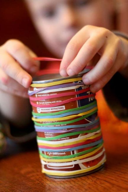 This activity is a great way to keep kids busy - just rubber bands and a soup can from the pantry!