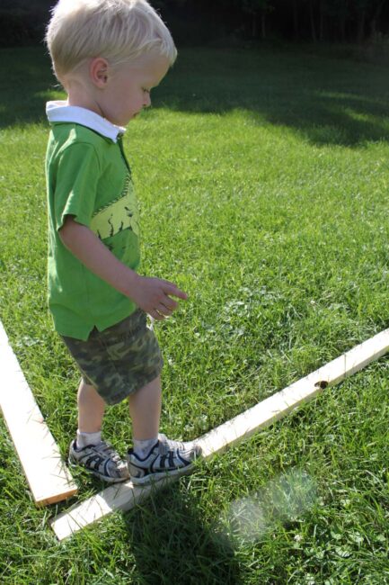 This is a simple DIY balance beam for toddlers to practice balancing, which is a major gross motor skill for every toddler, and preschooler, to learn.