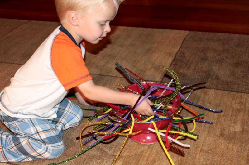Just pipe cleaners and a colander - such a simple fine motor activity for toddlers to try.