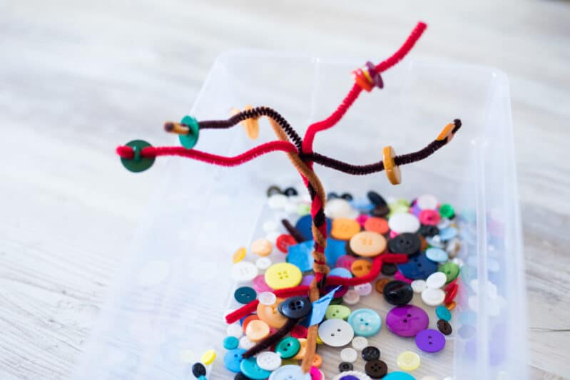 Pipe cleaners and buttons make a fun, gorgeous busy bin for fall!