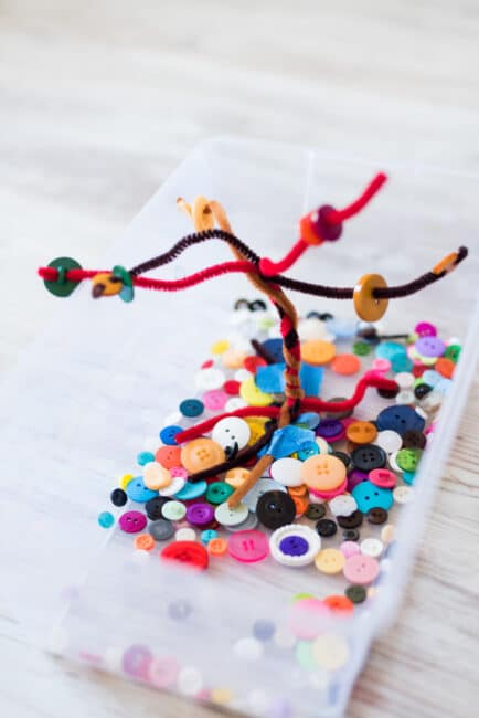 Set up an easy fall button tree busy bin for your kids with a few always-on-hand supplies.