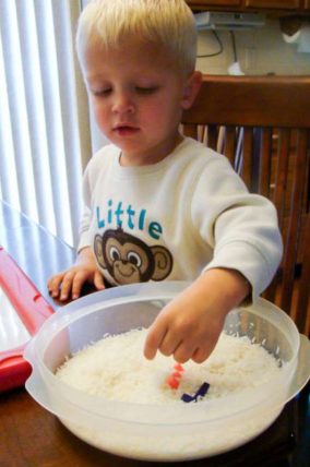 Use a rice sensory bin to find and spell your name