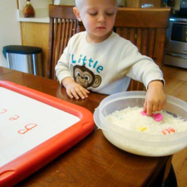 Use a rice sensory bin to find and spell your name