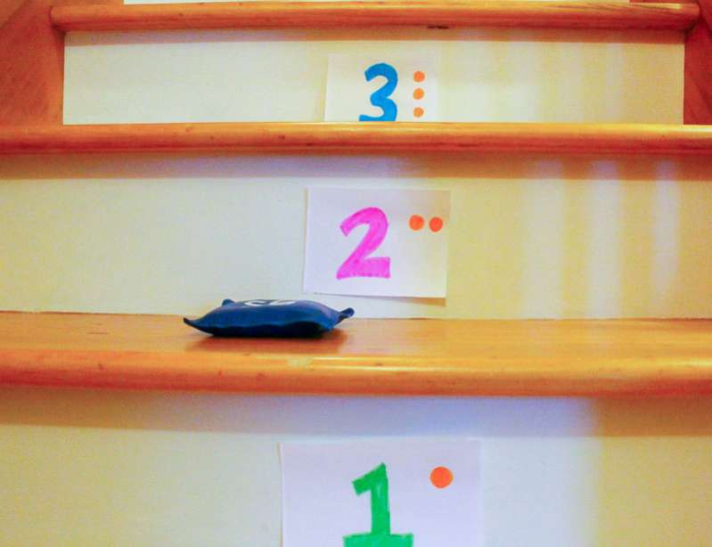 A simple bean bag number toss game on the stairs is a great activity for preschoolers!