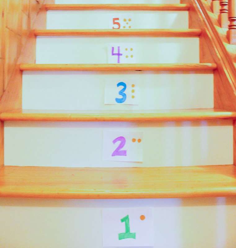 A simple bean bag number toss game on the stairs is a great activity for preschoolers!