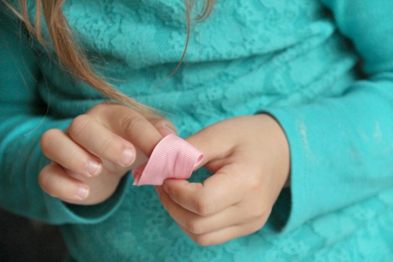 Kids can build fine motor skills with this simple fine motor knot tying activity.