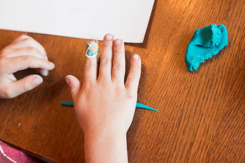 A play dough activity that gets kids strengthening their hands and learning their name.