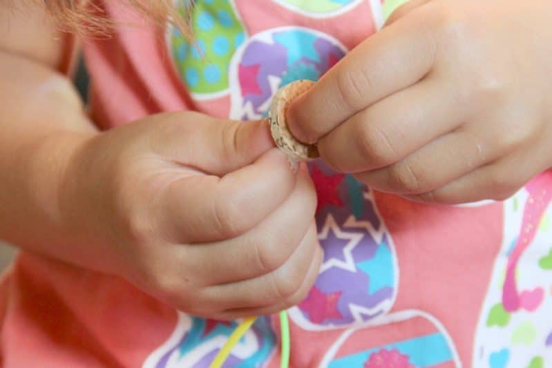 Cork bead bracelets are fun to make using cork to create beads for fine motor threading that kids will love. 