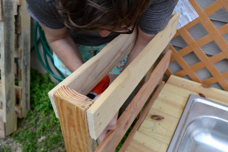Use the sides of the mud kitchen for shelves or planters