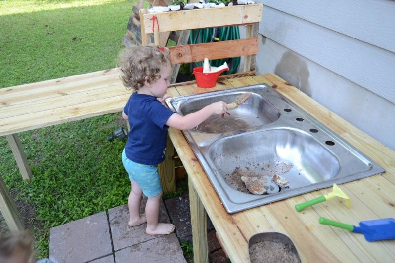 A mud kitchen is perfect for messy outside fun