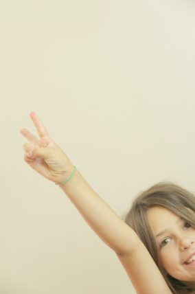 Mother and child raising their arms to signal each other
