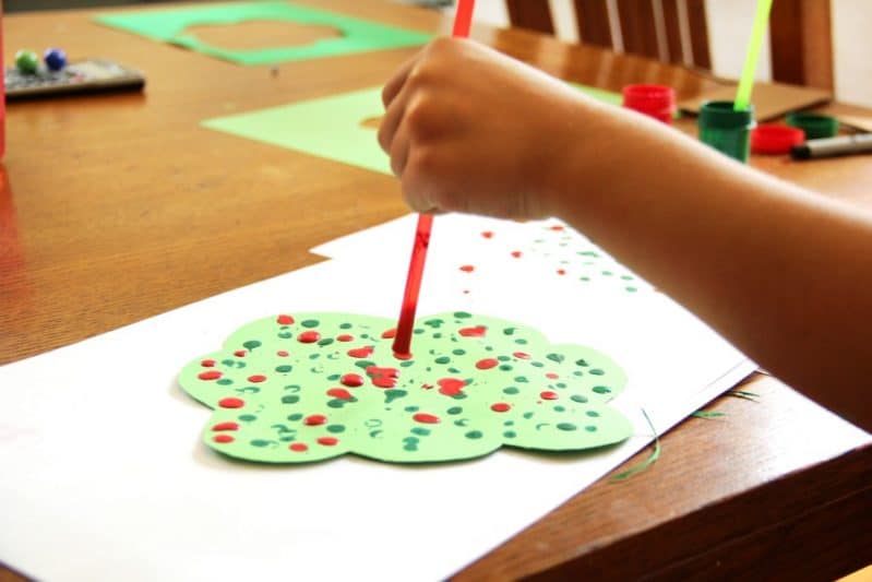 Kids love to create this straw drop painting apple tree craft!