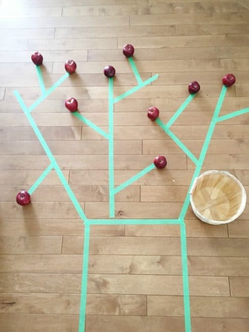 Apple tree picking activity that's great for gross motor skills