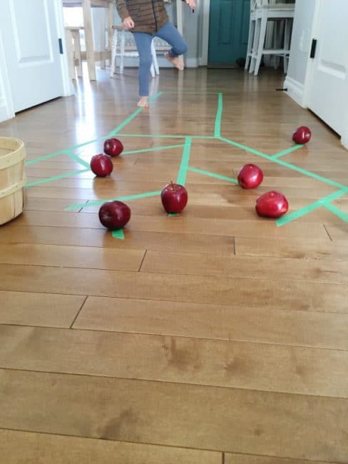 Work on gross motor skills when you go apple picking indoors!