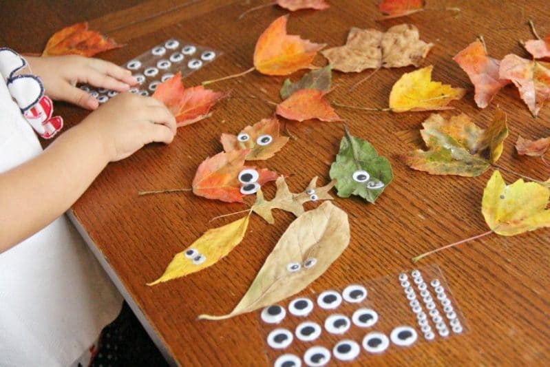 Toddlers will love to make this leaf people fall craft with real leaves.