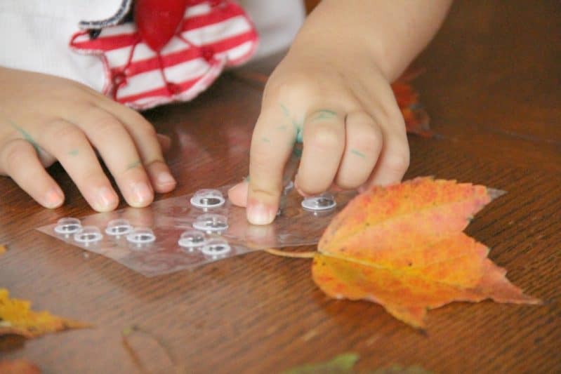 Making this leaf people fall craft is a great way to build fine motor skills with kids.