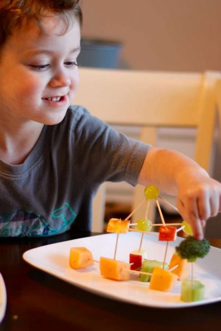 Encourage healthy snacking with fruit and veggie building for kids.