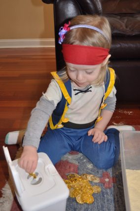 Counting treasure with a treasure hunt sensory bin