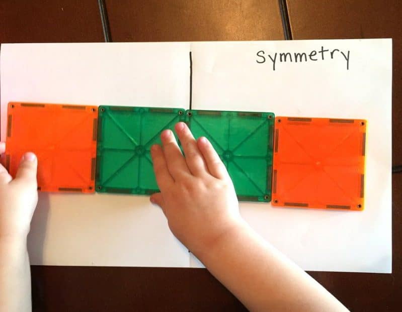 This is a super easy, hands-on preschooler activity for learning symmetry. Explore symmetry in nature and create symmetrical images with blocks and toys!