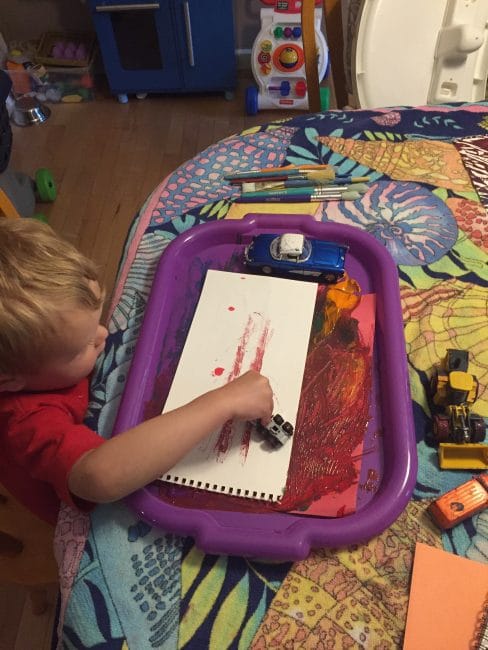Process Art for Toddlers - this truck painting transfer activity gives their playful painting a purpose.