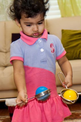 This scoop and transfer activity looks would keep a toddler busy for hours!