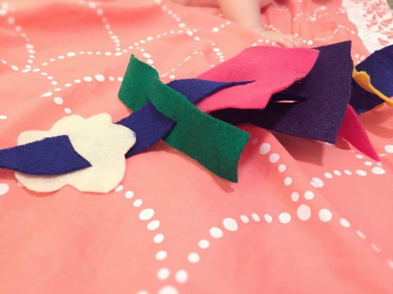 Help your baby explore felt shapes and practice fine motor skills with this easy baby felt play activity.