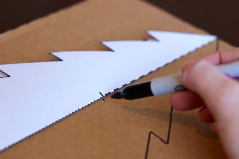 To make your tabletop Christmas tree, trace the printable template onto cardboard.