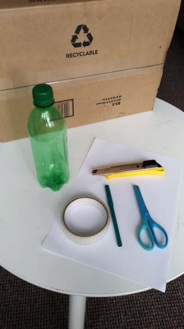 Upcycle pop bottles and a cardboard box to build a DIY number matching box