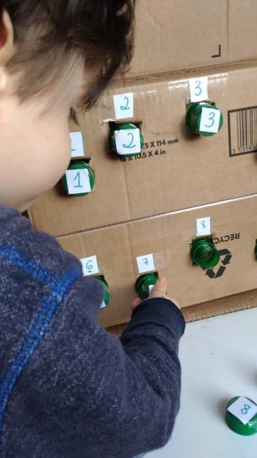 Practice number recognition and fine motor skills with a number matching box