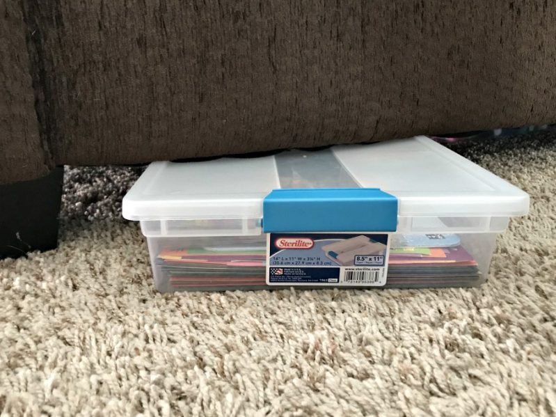 Store your sticker busy box in a small container under your couch for easy access