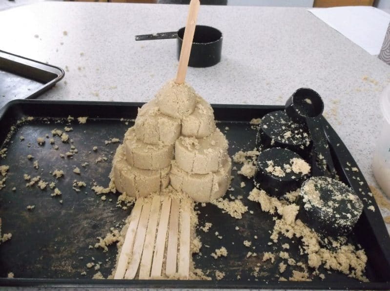 Make a pyramid shape with layers of scoops for your brown sugar sand castle for indoor beach fun.