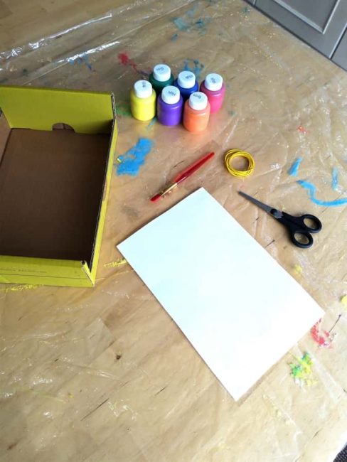 Use supplies from around the house for rubber band splatter painting!