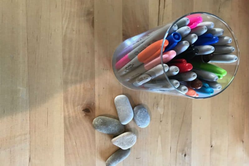 DIY story stones with smooth stones and permanent markers.
