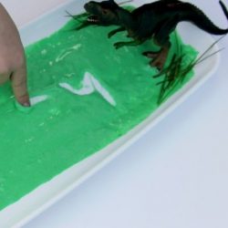 Dive into a dino swamp in a sensory writing activity from The Imagination Tree