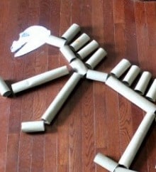 Upcycle toilet paper tubes into a dino skeleton with this activity idea from Your Modern Family